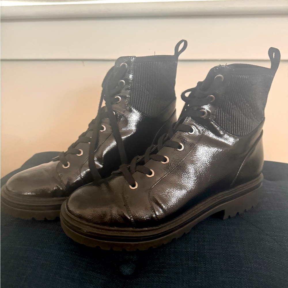 Combat shiny lug heel lace up boots.